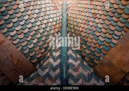 Close-up of a rooftop in Palermo, featuring colorful, patterned tiles arranged in a geometric design. The tiles showcase shades of blue, orange, and b Stock Photo