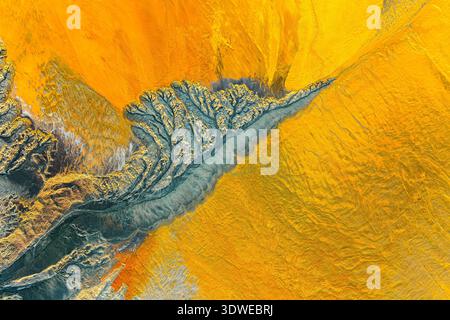 Aerial view of Huelva Riotinto showcases striking abstract patterns and vibrant colors. The land's fractal-like formations create a mesmerizing, color Stock Photo