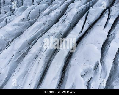Close-up view of the striking ice formations on Skaftafell Glacier, Iceland. The textured surface displays natural patterns carved by time and weather Stock Photo