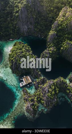 Aerial view of a tropical lagoon with turquoise water surrounded by ...