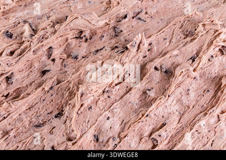 Close-up of creamy chocolate ice cream with a rich, swirled texture and chocolate chunks, showcasing the intricate details and mouthwatering appearanc Stock Photo