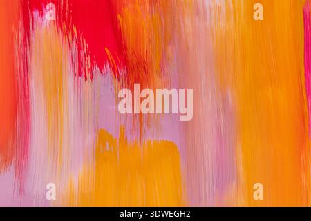 A striking abstract acrylic paint background with vibrant reds, oranges, and yellows blending seamlessly. The brushstrokes create a dynamic and textur Stock Photo
