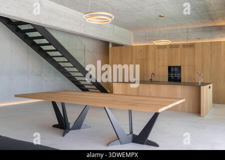 A modern kitchen interior showcases sleek design and natural light ...