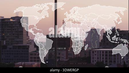 Displaying translucent world map overlay spanning urban skyline at dusk, showing crane and antennas Stock Photo