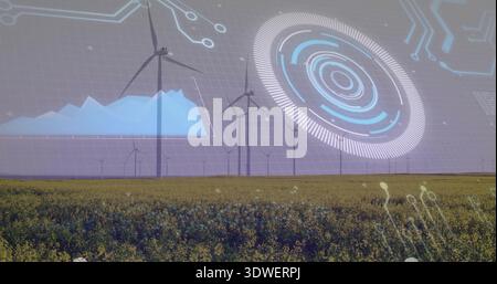 Displaying row of wind turbines featuring digital monitoring overlay over rural field, HUD graphics Stock Photo