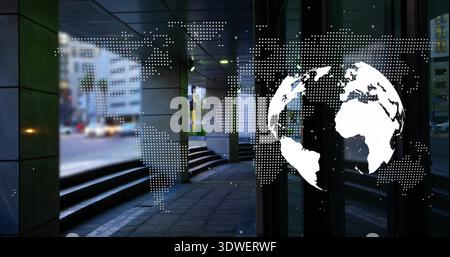 Featuring white globe graphic and dotted world map on right-side glass, revealing tiled walkway Stock Photo