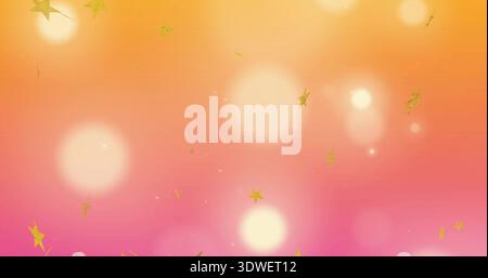 Glowing bokeh and gold star confetti floating on orange-pink gradient backdrop with glitter specks Stock Photo