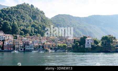 Picturesque view of Varenna, a charming town on the eastern shore of Lake Como, Italy, with colorful houses, lush greenery, and serene water reflectin Stock Photo