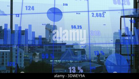 Displaying blue data overlay covering window in office, showing bar and pie charts, numbers, crane Stock Photo
