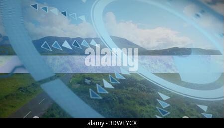 Displaying pale blue circular HUD overlay centered on rural road, showing rings and chevrons Stock Photo