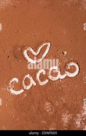 A close-up image of cacao powder with a heart shape etched next to the word cacao. The rich texture and color evoke a sense of warmth and indulgence. Stock Photo