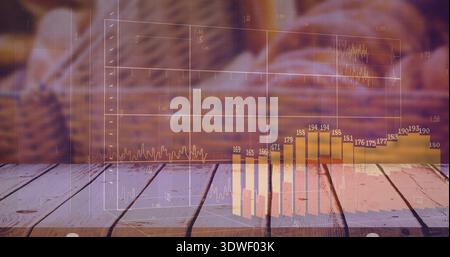 Showing translucent finance line graph and bar chart overlaying wood table in lounge with labels Stock Photo