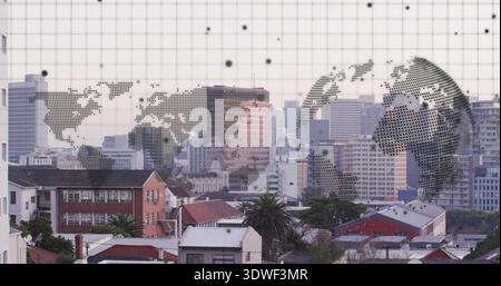 Displaying dotted map and globe graphic floating on grid panel at city skyline with rooftops Stock Photo