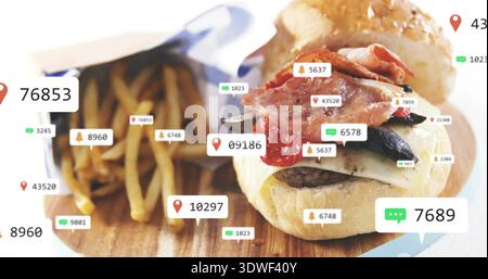 Capturing burger on board sitting on table in studio, with fries in metal cup, UI overlays Stock Photo