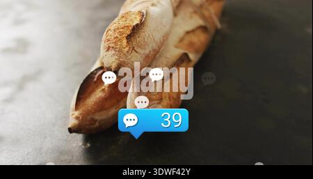 Displaying three crusty baguettes resting on dark countertop, showing white speech bubbles, blue 39 Stock Photo