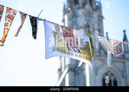 Description: Carnival garlands hang in an alley in Niederburg with the cathedral in the background. Constance, Baden Württemberg, Germany. Stock Photo