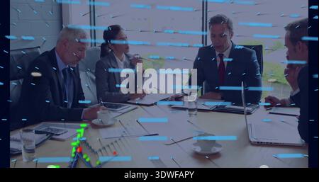 Leading male speaking, team taking notes wearing business attire in boardroom with laptops, overlay Stock Photo