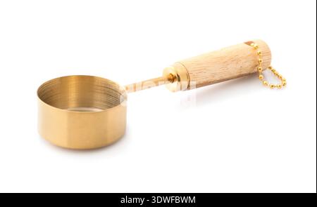 One golden scoop isolated on white. Kitchen utensil Stock Photo