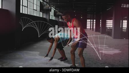 Performing training duo in turquoise and red tanks doing drill on warehouse floor, dotted arc Stock Photo
