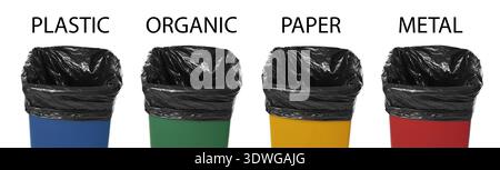 Garbage cans in different colors for waste separation isolated on white. Each for different types of trash (paper, plastic, organic and metal) Stock Photo