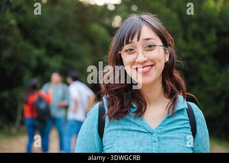 Female student smiling outdoors on campus Stock Photo