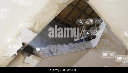 Peering man wearing striped shirt and jeans through ceiling hole in ruin, icons, copy space Stock Photo