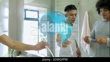 Leaning man in white tee, gray-shirted man holding brush by bathroom sink mirror, holographic globe Stock Photo