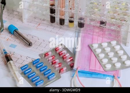Medical tools medications are arranged on table for lab testing patient care in healthcare setting. Stock Photo