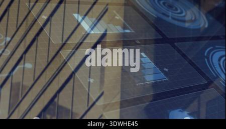 Displaying translucent HUD panels over glass window mullions, with grid overlays and radar graphics Stock Photo