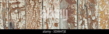 Rustic timber background with great texture, close up view. Cracked paint on wooden planks, aged by time. Super wide natural background with traces of Stock Photo