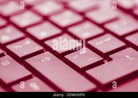 Macro keys of keyboard with wine color toning, angle view, soft background with copyspace Stock Photo