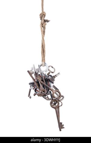 Two-way steel round search magnet with a many old keys, isolated on white background. Search in ponds and rivers, hunting for treasures Stock Photo