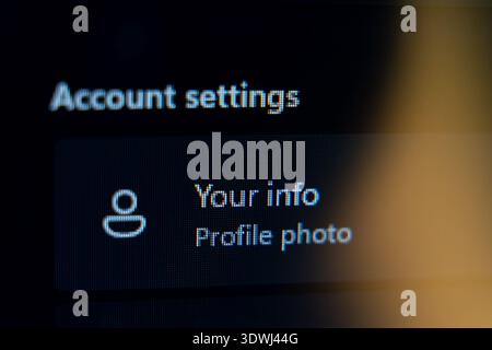 Close-up of account settings menu on a digital screen displaying user profile and information options, managing personal data and identity on a dark u Stock Photo