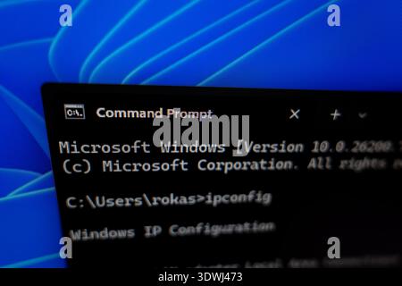 Close-up of Windows Command Prompt window on a computer screen showing ipconfig command, concept for network troubleshooting and system administration Stock Photo