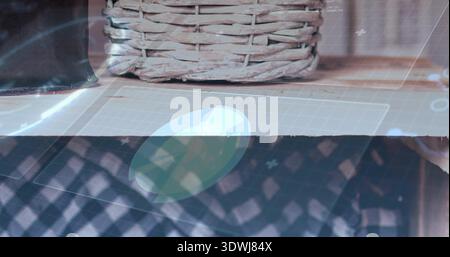 Showing woven wicker basket on tabletop, with grid mat, disc, dark fabric, leather case, overlay Stock Photo