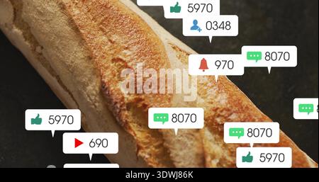 Showing single long baguette lying diagonally on dark countertop, with social notification overlays Stock Photo