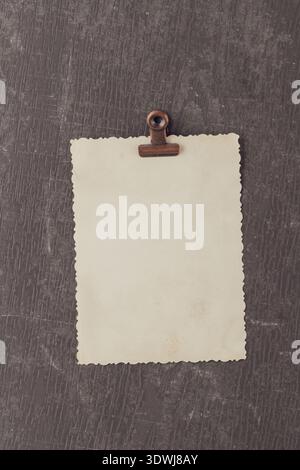 Empty vintage photo card over brown grunge textured dirty background with copy space. Rero style photo. Stock Photo