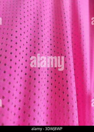 beautiful pink fabric in a pattern, background for full screen, folds of fabric, purple lace, macro photo of fabric material a piece of pink material Stock Photo