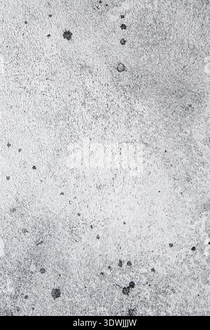 Grey abstract background texture with plaster stains and splashes. Textured gray old shabby surface Stock Photo