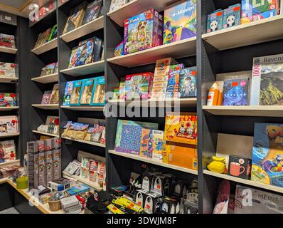 Pforzheim Germany Februar 25, 2026 Kids Shelf Overflowing With Colorful Books And Toys, Interactive Board Stock Photo