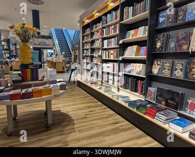 Pforzheim Germany Februar 25, 2026 Spacious Bookstore Interior Showcasing Long Display Shelves And Curated Stock Photo