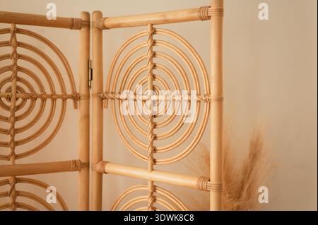 Close up of rattan room divider with circular woven pattern at home Stock Photo