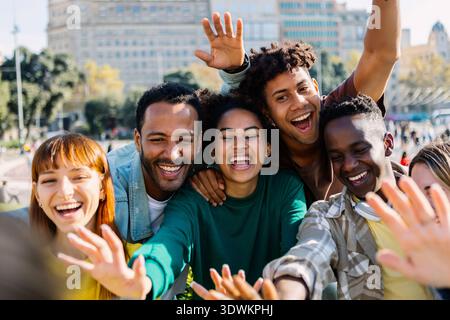 Young group of happy multiracial friends having fun in the city Stock Photo