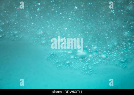 Abstract macro texture of light blue foam and soap bubbles Stock Photo