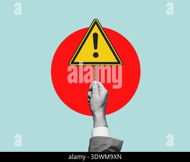 Warning sign. Hand holding a warning sign, alarm message, caution, notice, warning in a business context - concept. Flat design. Stock Photo