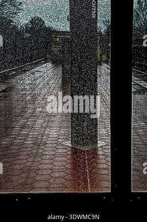A rainy day on a train platform Stock Photo