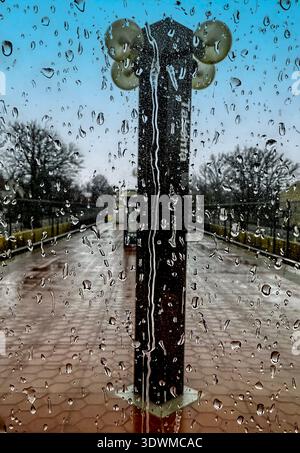 A rainy day on a train platform Stock Photo