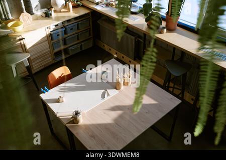 Empty Art Classroom Showing Sunlight Illuminating Creative Workspace Stock Photo