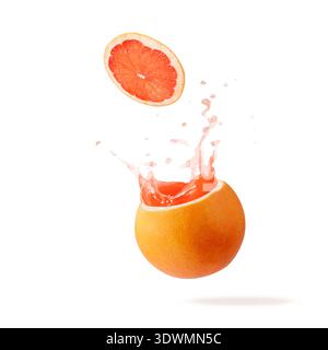 Fresh pressed grapefruit juice splashing  from fruit isolated on white background with copy space. Grapefruit slice  flying falling into fruit. Stock Photo