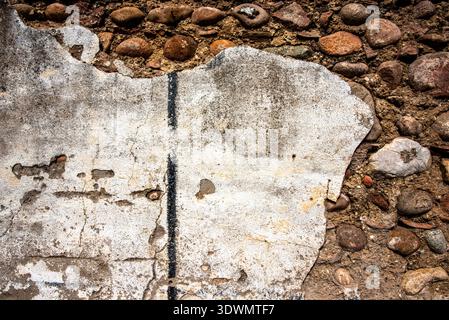 texture on stone wall with pieces of white mortar in Custoza Verona Veneto Italy Stock Photo